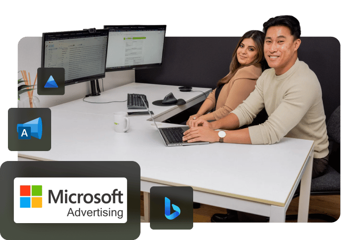 Bing advertising office photoshoot including Amanda and Adriel. Two Bing ads certified professionals sharing a desk for a photoshoot.