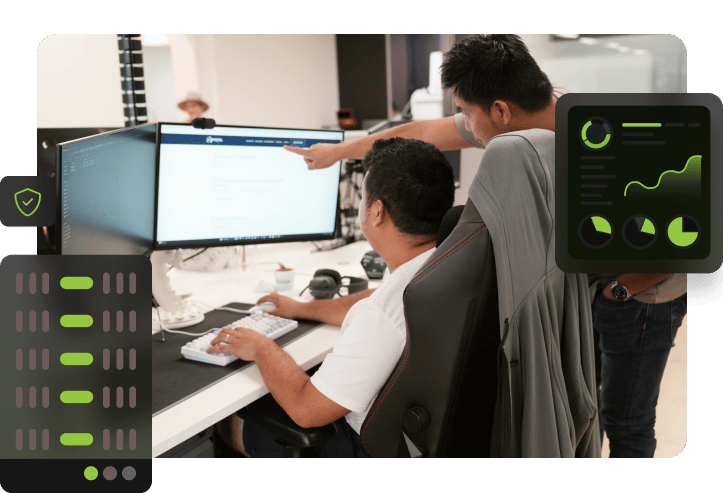 Two Click Click Media team members at a dual-monitor workstation reviewing server configuration, with a hosting rack icon, security shield, and performance monitoring dashboard overlaid.