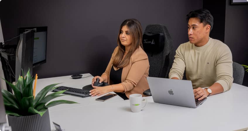 sydney office photoshoot - adriel and amanda showing working together on a programmatic ad campaign.